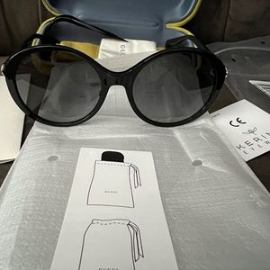 Gucci black oval shape